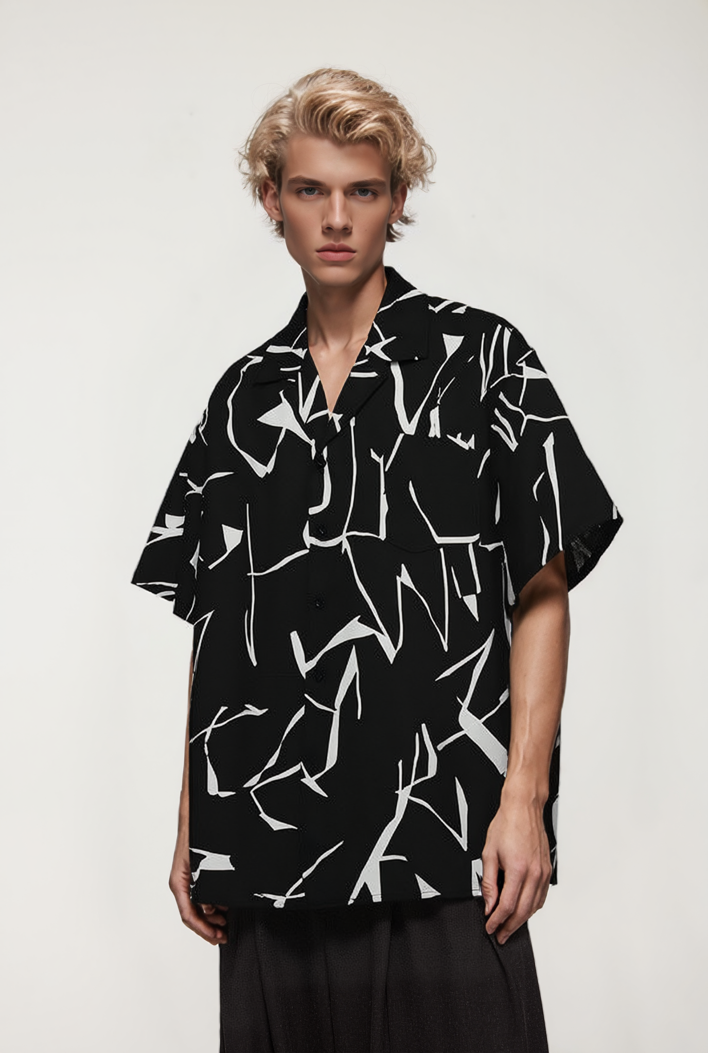 OLA FAN Black Cuban Collar Short Sleeve Shirt front side view on male model – minimalist high street wear