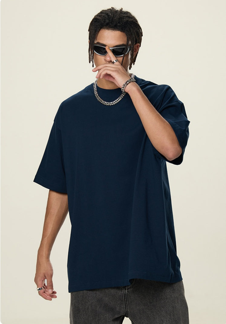 OLA FAN Dark Blue vivid T-shirt front side view on male model – minimalist high street wear