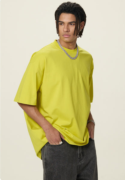 OLA FAN Lemon Yellow vivid T-shirt front side view on male model – minimalist high street wear