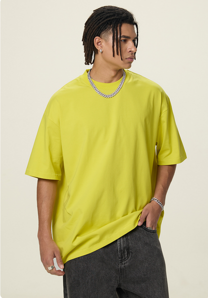 OLA FAN Lemon Yellow vivid T-shirt front side view on male model – minimalist high street wear