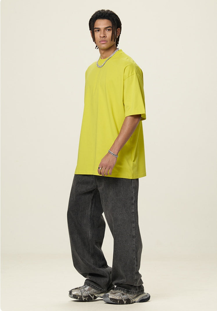 OLA FAN Lemon Yellow vivid T-shirt side full view on male model – minimalist high street wear