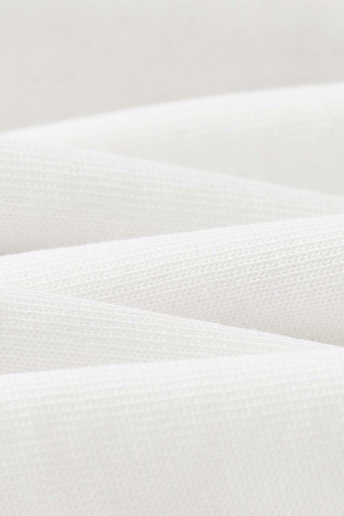 OLA FAN Nature Protect T-shirt material detail close shot–minimalist high street wear