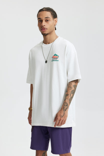 OLA FAN White Nature Protect T-shirt half front view on male model – minimalist