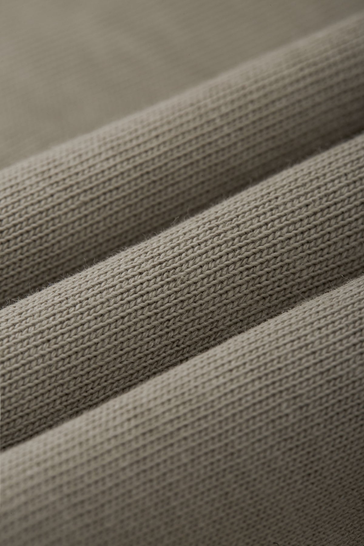 OLA FAN camp T-shirt material detail close shot–minimalist high street wear