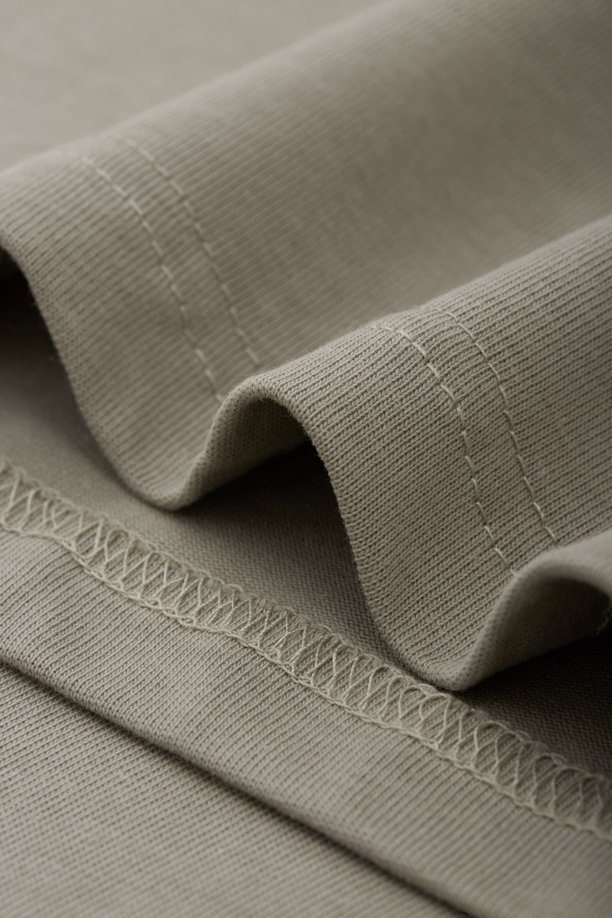 OLA FAN camp T-shirt material detail close shot–minimalist high street wear