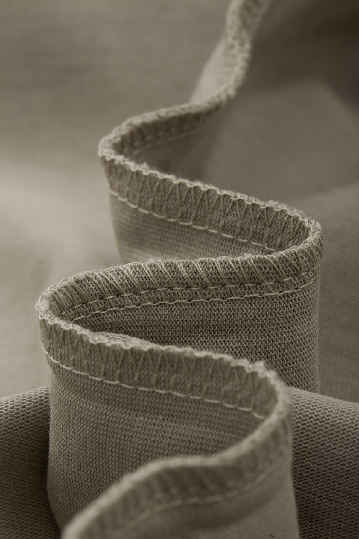 OLA FAN camp T-shirt material detail close shot–minimalist high street wear