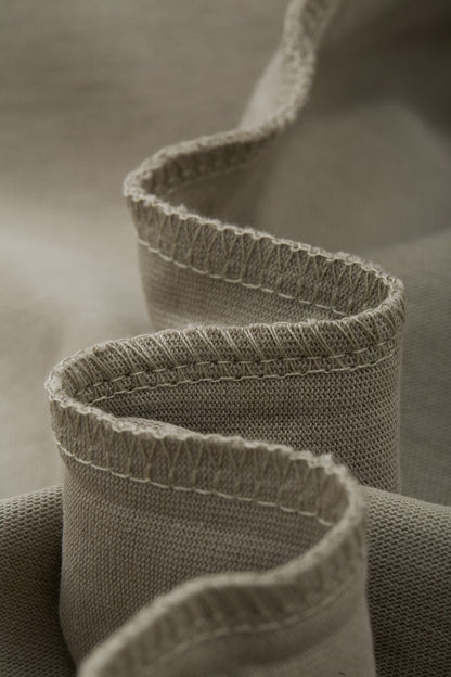 OLA FAN camp T-shirt material detail close shot–minimalist high street wear