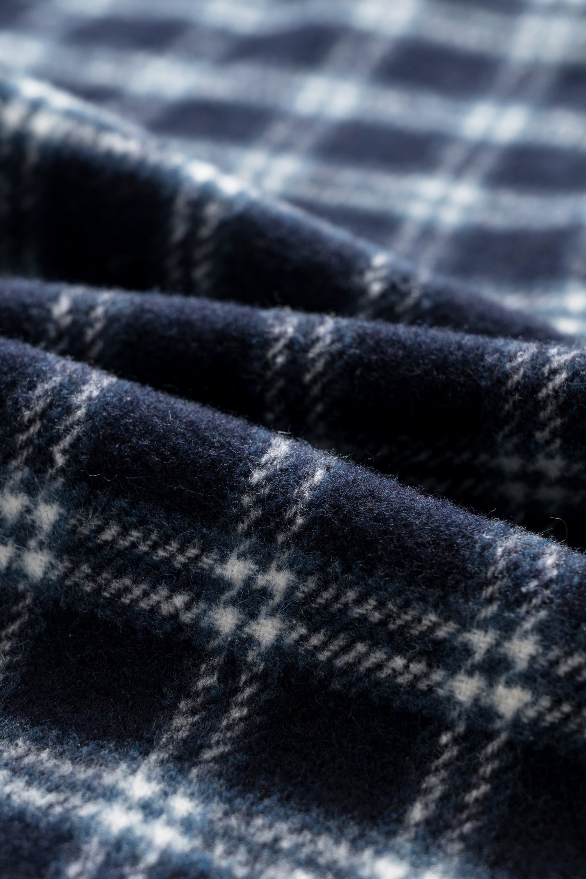 OLA FAN dark blue plaid shirt close-up fabric texture – soft cotton material detail