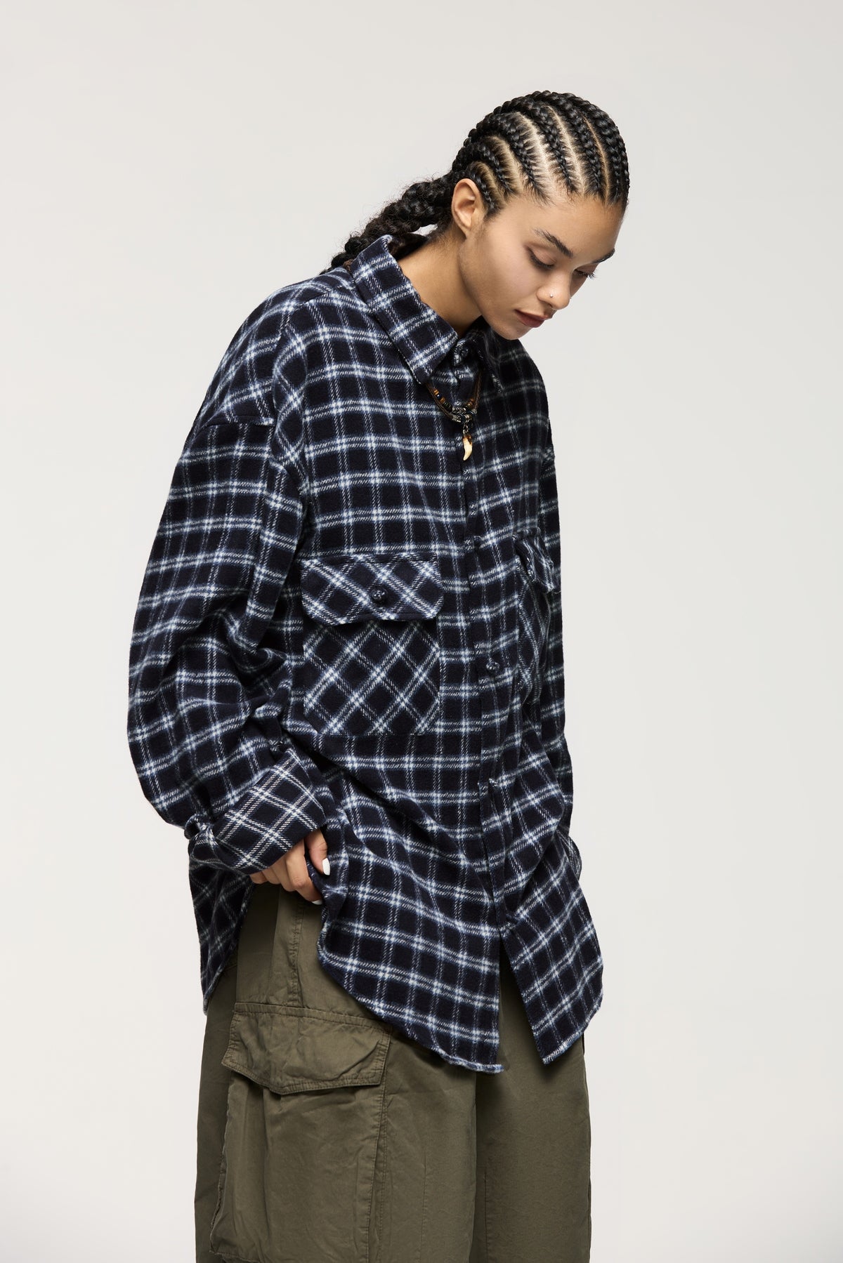 OLA FAN dark blue plaid shirt side half view on female model – unisex oversized fashion