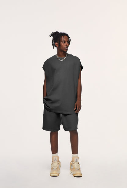 Front view of heavyweight unisex tank top by OLA FAN in dark grey