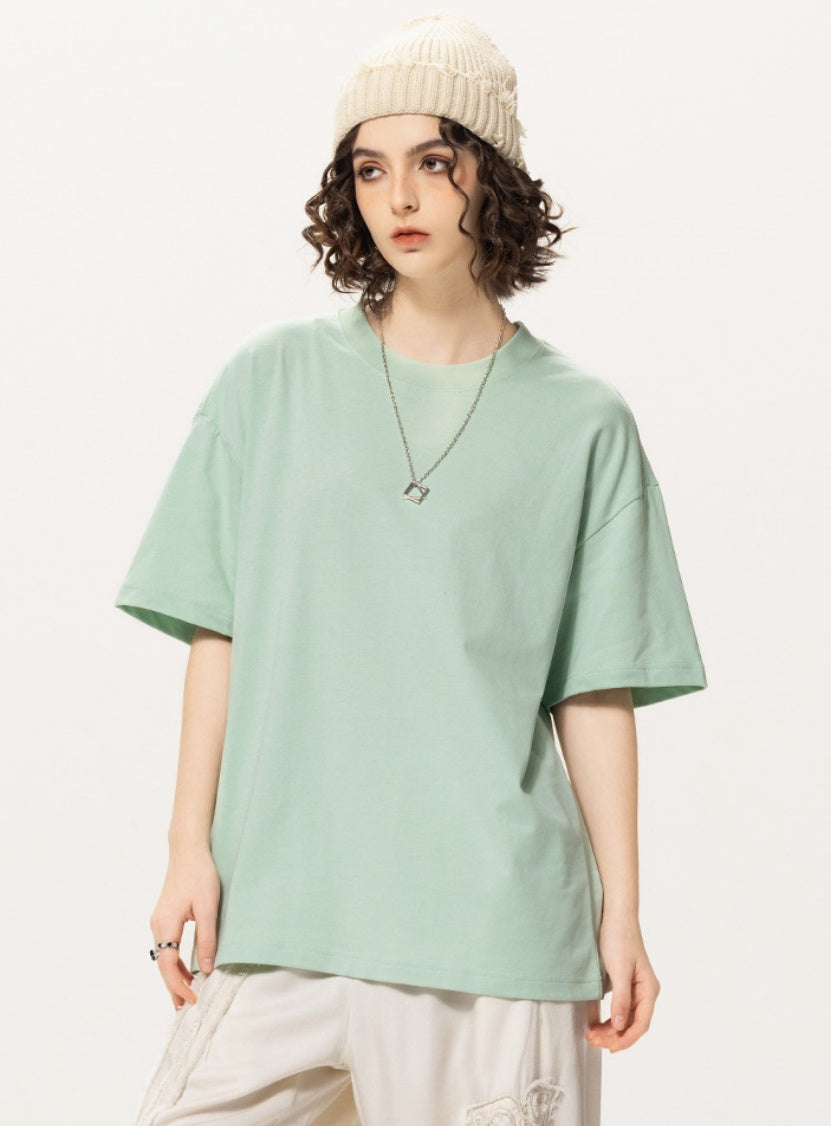 OLA FAN light green vivid T-shirt front side view on female model – minimalist high street wear