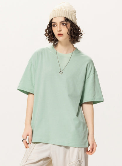 OLA FAN light green vivid T-shirt front side view on female model – minimalist high street wear